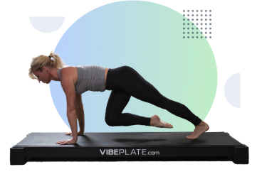 Woman performing a plank on VibePlate equipment