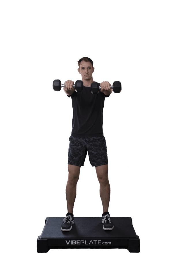 Man performing dumbbell exercises on VibePlate 2440