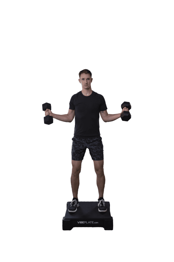 Man performing dumbbell exercises on a VibePlate 2424