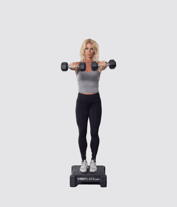 Woman performing dumbbell exercises on a VibePlate Mini