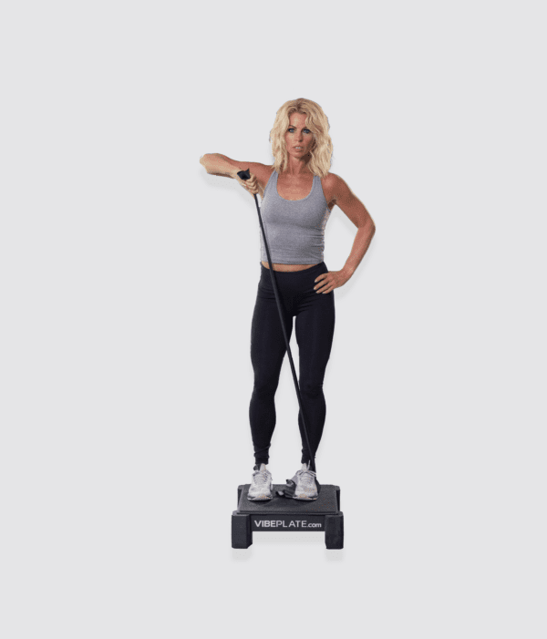 Woman performing tension cord exercises on a VibePlate Mini