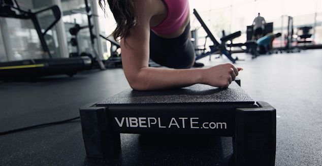 Close-up of the VibePlate Rev in a modern gym, showcasing advanced vibration technology